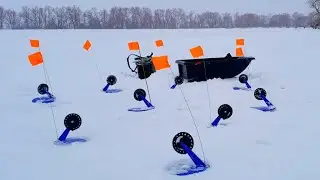 Fishing with tip-ups in a snowstorm. Pike are actively feeding.