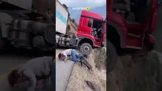 Truck driver jumps out seconds before landslide sends rig into ravine