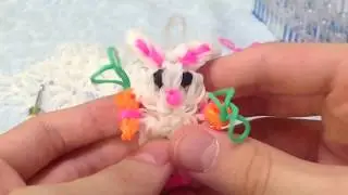 A rabbit made from rubber bands on a loom