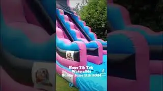 Huge inflatable Tik Tok waterslide water slide and pool at the end holding  up to 500 L of water .
