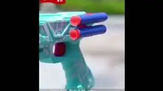 Пистолет с самолетом и пульками. A pistol with an airplane and bullets.