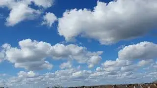 WHITE FLUFFY  CLOUDS  , NATURAL & NORMAL SKY.