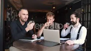 A Group of Three Stylish European Businessman Friends Entrepreneurs in a Cafe | Stock Footage - ...