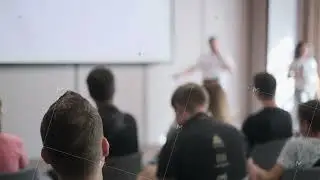Audience attentively listening to a presentation in conference room