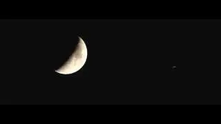 Plane crosses paths with Moon