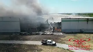 08-16-2024 Marietta, OK  - Tornado damaged warehouse burns during demolition