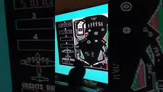 Black cat trying to play pinball on my TV.