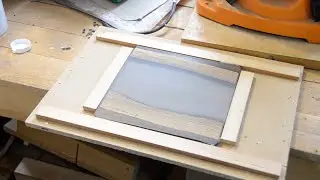 Making coasters from grey resin and hardwood.