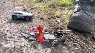 Crushed toy police car