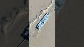 China Has a Fake US Aircraft Carrier on Railroad Tracks in the Desert