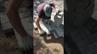 Laying bricks in a herringbone pattern. Rate from 1 to 10  #brick #patio #paverblocks #concretetiles