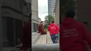 Protester stops scaffolders working after climbing scaffold