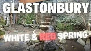 Collecting Glastonbury Spring water - The red & white spring into Stainless steel containers