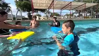 Teaching kids to swim part two using kickboards watch it