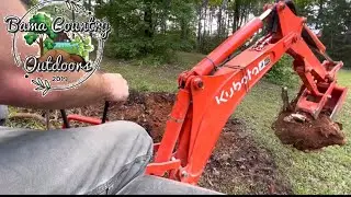 Kubota L2501 w/BH77 Removing Brush and a Root Ball. 101 use’s for a compact tractor