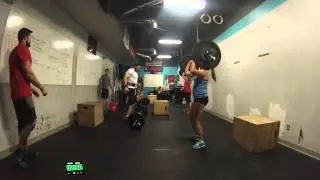 Coach Erin J., Kristin S., and Andrew O. perform WODThrowdown 