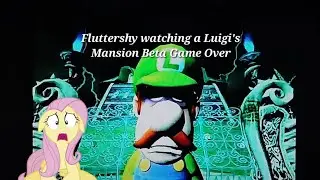 Fluttershy watching a Luigi's Mansion Beta Game Over