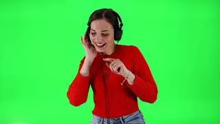 Copyright free 4k green screen video | Woman happily dancing while listening to music