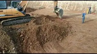 Рытье и планирование котлована полноповоротным экскаватором