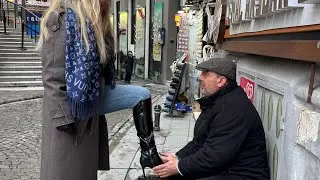 BLONDE HAVING HER BOOTS SHINED 