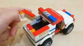 Крутая самоделка из лего. Необычный пикап из Lego. С мигалками и с открывающимся кузовом.