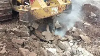 Caterpillar D8H dozer ripping through hard rocks!
