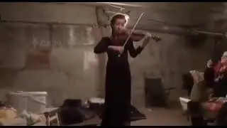 A girl in a bomb shelter plays "What a Moonlit Night" on the violin. #Ukraine