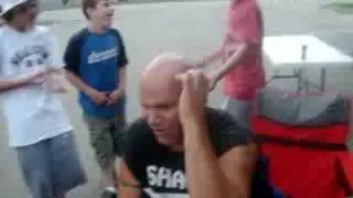 throwing pop its on a bald head.
