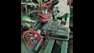 A caliper for lathe in metal with their hands in the work