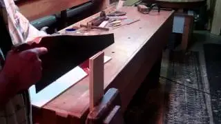 Using a hand saw to rip boards to thickness