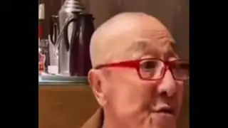 Old chinese man singing Ching Cheng Hanji