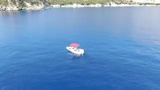 Small boat in the blue