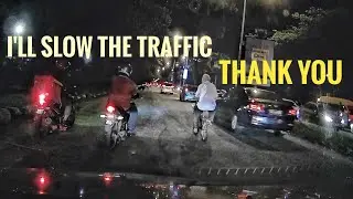 Motorcyclists help an elderly cyclist