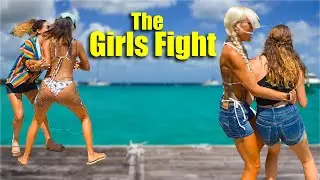 The girls try to throw eachother off the dock!