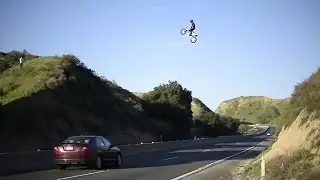Kyle Katsandris jumps motorbike across freeway!