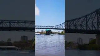 A HUGE helmet drifts down the Brisbane River... 