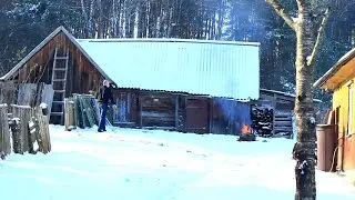 Life in a forest village. We break down the barn in the cold. We lit the wood stove