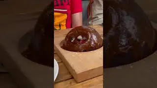 Chocolate orb covered in bbq sauce. [WARNING: Extra Saucey]