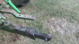 Working on the tractor draft arms