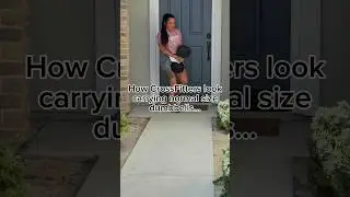 CrossFitter carrying normal sized dumbbells…