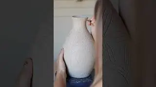 Carving a red panda vase
