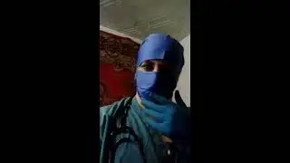 Surgeon in blue surgical mask and blue cap
