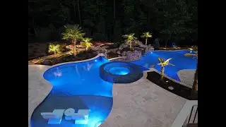A Luxurious Pool with Spa and Cascading Waterfalls | Discover the Ultimate Backyard Retreat
