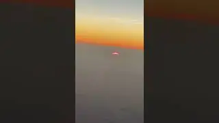 The sun disappears under the clouds Flight from Cairns, Australia to Japan over the Philippine Sea
