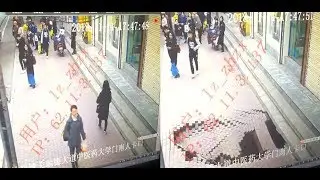 Sidewalk suddenly gives way in Lanzhou, sending woman falling into massive sinkhole