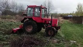 Трактор Т-25 с почвофрезой в работе