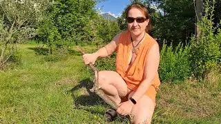 Lighting a fire. Cooking in a mountain village. Mila. cooking on an open fire. Mila naturist.