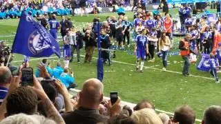 Fabregas shows off the trophy to MHL