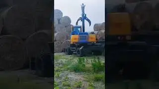 Baler picker demo on the farm used by Jinggong wheeled excavators with customized grabber