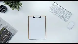 Putting Down A Clipboard With Paper And Pen